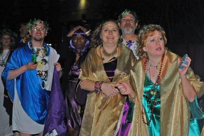 The Toga Krewe attends the Bacchus Parade