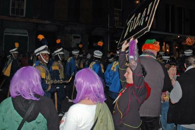 The Toga Krewe attends the Bacchus Parade
