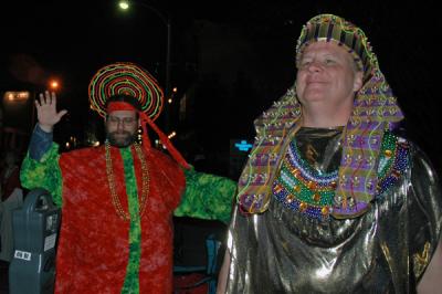 The Toga Krewe attends the Bacchus Parade