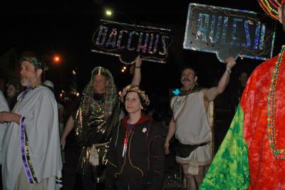 The Toga Krewe attends the Bacchus Parade