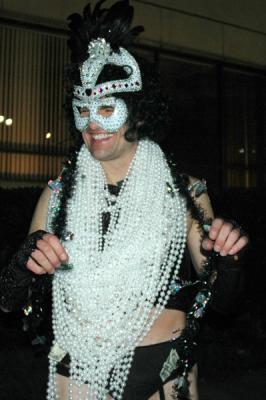 The Toga Krewe attends the Bacchus Parade