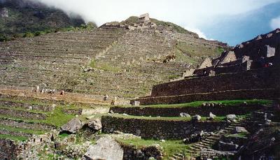 At the top is the funerary level, where the stock photos of Machu Picchu (Old Peak) are taken, 
showing Wayna Picchu (Young Peak) rising in the background. The Watchman's Hut overlooks the 
lower plateau.