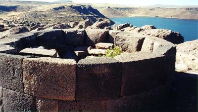 Sillustani - top of smaller tomb, with lake behind