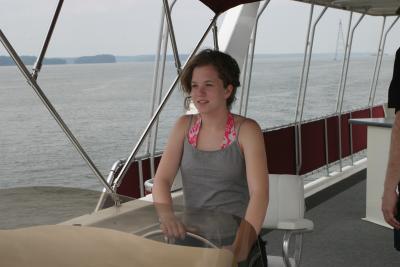 Megan drives the houseboat