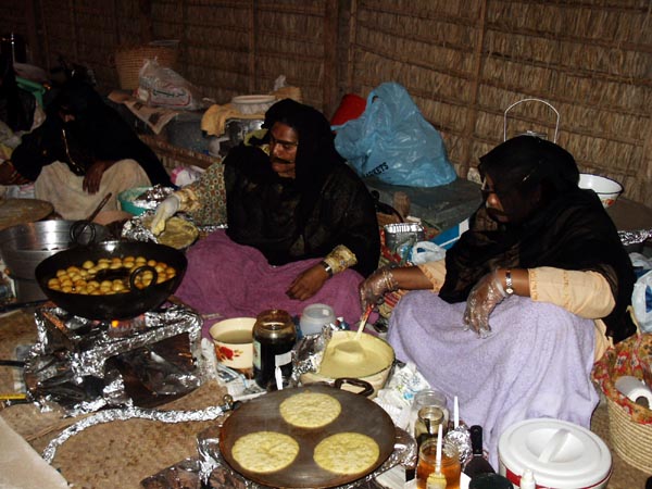 Women cooking at Heritage Village