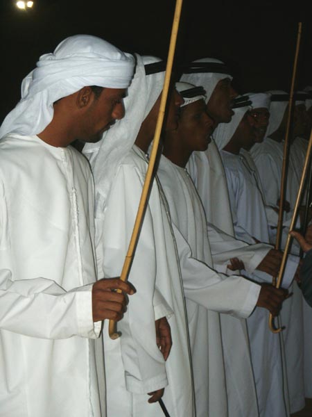 Emiratis performing traditional bedouin dancing