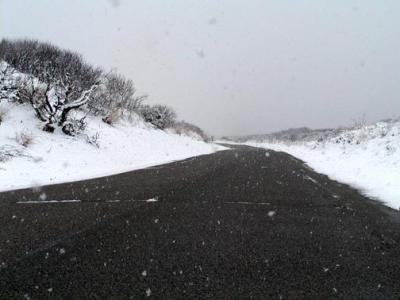 Same road, two months later, during an unusual snowfall.