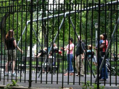 Swinging Toddlers in Washington Square Park