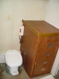 A SHIRT CLOSET WILL BE BUILT ON TOP OF THIS VANITY AND A CHINA TOILET  WILL REPLACE THE PLASTIC ONE
