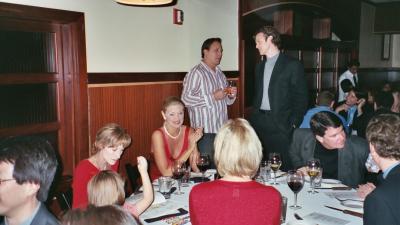 Glen (standing on the right) hosting his Christmas Party