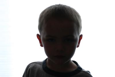 Ok, here is the original.  The facial details were brought out using an extreme levels adjustment, hence the grainy, pointilistic detail. The background was created using a Render-Clouds with two very similar light colors, then several applications of the Plastic Wrap filter.