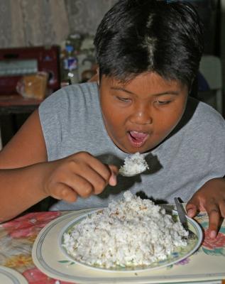 Joco eating rice