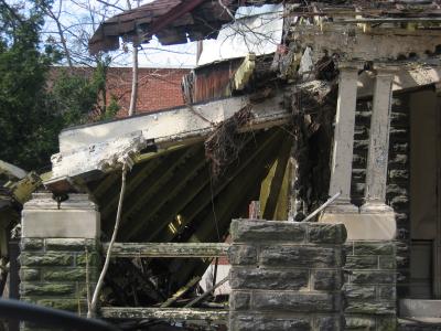 <b>March 2004.</b>  The porch roof has slumped further.