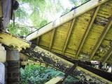 The porch roof has pulled away from the stone wall.