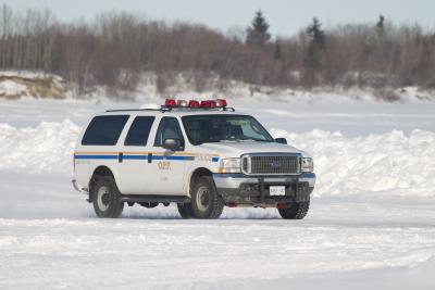 Ontario Provincial Police Ford Excursion on the Moose River