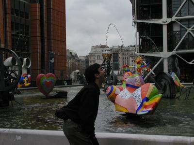 rich catches squirting statue water