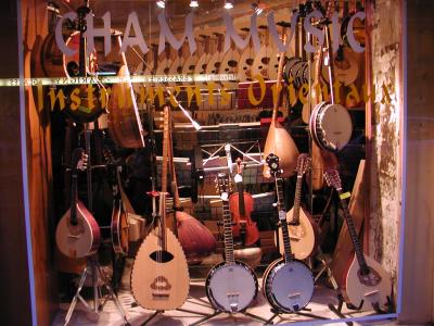 neat stringed instrument store-bizouki on right