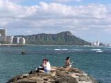 View of Diamond Head as a backdrop for anglers at Ala Moana Beach Park Harbor side.