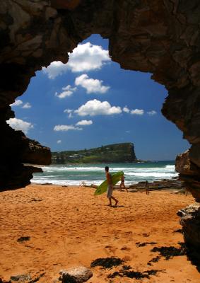 Avalon headland from cave with surfer