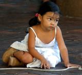 Little girl watching busker