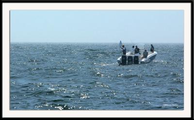 Former President of the United States, George H.W. Bush, fishing off Walker's Point, his Kennebunkport estate in Maine on July 31, 2004. President Bush is the man in the center holding a fishing pole. He was tailed by an Zodiac amphibious attack boat staffed with 4 Secret Service agents. (See other photo.)