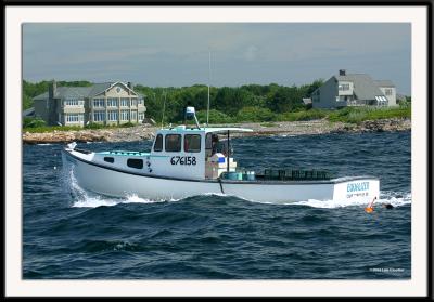 A Maine lobsterman plying his trade in moderately choppy seas.