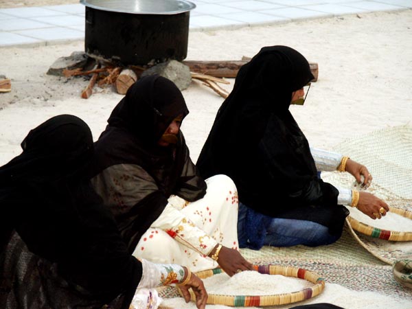 Emirati women preparing the food