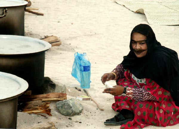 Emirati women watching the pots