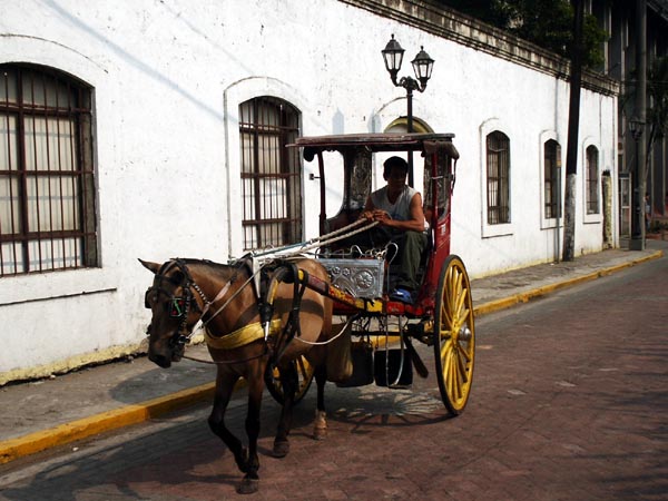 Kalesa heading up Gen Luna Street for Fort Santiago, Intramuros