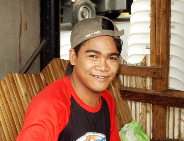 Filipino guy at an outdoor cafe, Intramuros