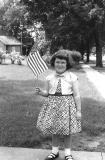 Elizabeth on 4th of July in Hopkinton, Iowa.- 1956