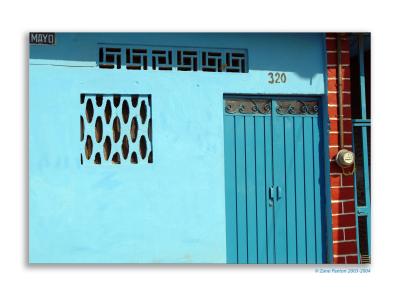 An street entrance to a typical house, usually opening onto an interior couryard.  No big front yards like in the USA.