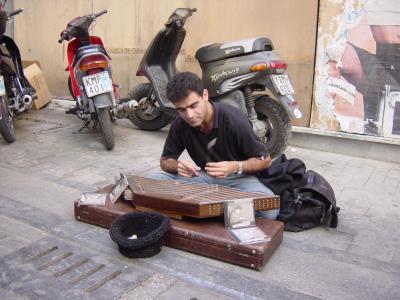 Iranian musician playing santur, Greece