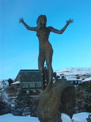 Garden lady dancing. chatholic church in the background