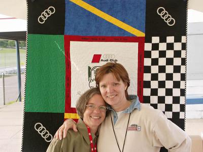 Marcia M. and Dawn H. in front of the Quilt they made