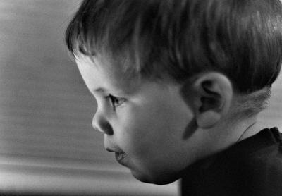 Ethan at the Laptop Again
I really didn't intend for this month to turn into a gallery of my kids, but it is anyway.  I have had very little time and my kids are always close by for a quick shot!  I hope to get back to some more diversified and fun photography soon...  (although I enjoy taking shots of the boys!)
I shot this in RAW just to play around with the conversion software in Photoshop CS.  I am shooting a wedding at the Air Force Academy in two weeks and needed to play with the RAW format for practice...  Also, I have been editing photos for the last several days on my laptop.  I will probably find that the level adjustments and the color casts are all wrong when I view them on my desktop...  Bear with me...