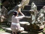 Balinese lady praying at temple steps, Mengening