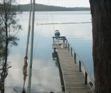 Fisherman on a jetty,  Queens Lake