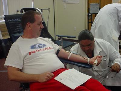 Jeffrey Lewis in 2004  in chair donating blood