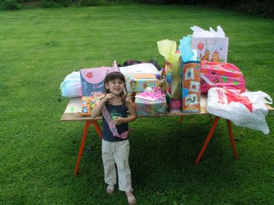 Sarah standing with all her gifts