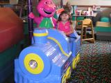 Sarah on Barney ride at Chuck E. Cheeses