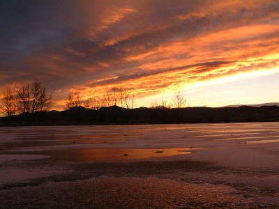 Sunset across a frozen lake