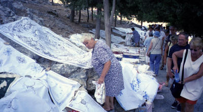A woman sells lace on the path to the Acropolis on Rhodes