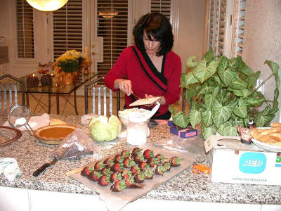 Jill applies a finishing touch. Look at those chocolate-dipped strawberries!