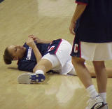 Taursi Allway checks her nail before the game