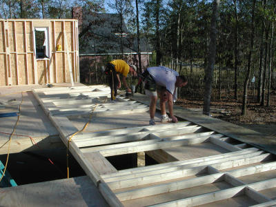 Carpenters build the front wall