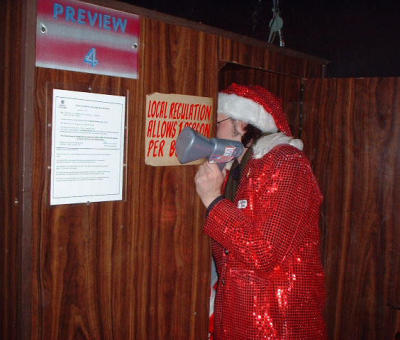 Santa catches a peep show in a sex shop