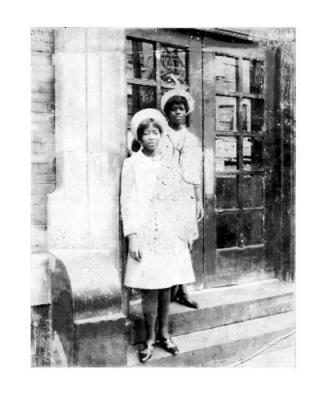Geraldine Brown (now Mungin) and sister Elaine (now Elaine Murphy) in front of their apartment building (240 W. 64th st  Phipps Houses) Easter Sunday 1966