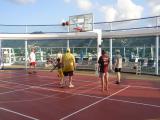 Playing basketball on the sports deck
