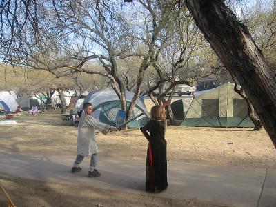 Ian and Zoe fighting with boffer swords